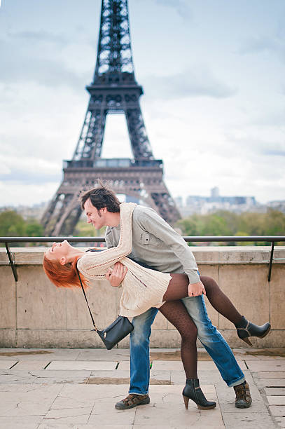 istock Loving couple dancing near the Eiffel Tower in Paris 486808825