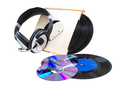 headphones, vinyl records and cd CD-R, DVD on a white background. isolated.