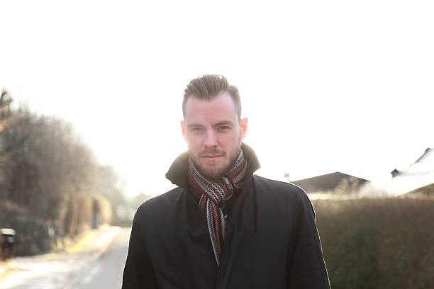 istock Fashionable man standing outside 486810062