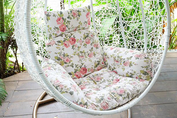 istock Vintage hanging chair with red seat 486811702