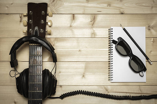 istock Old Guitar on the Wood Background 486811728