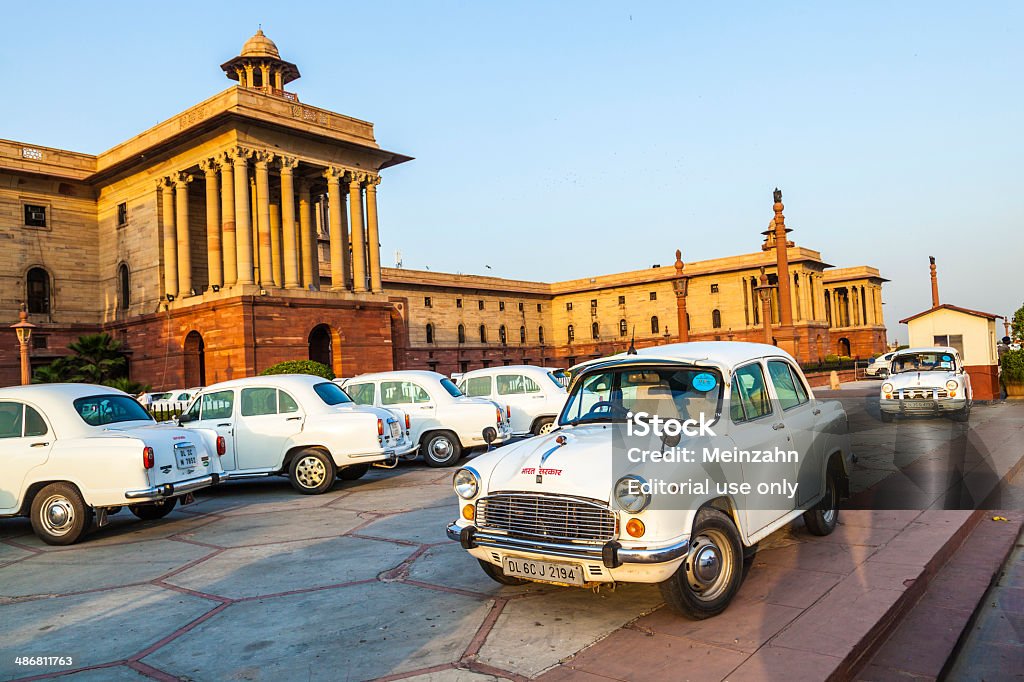 Official Hindustan Ambassador cars parked outside goverment building New Delhi, India - October 16, 2012: Official Hindustan Ambassador cars parked outside goverment building, North Block, Secretariat Building,  in Delhi, India. The production started in 1958 on base of the Morris Oxford model. 2011 Stock Photo