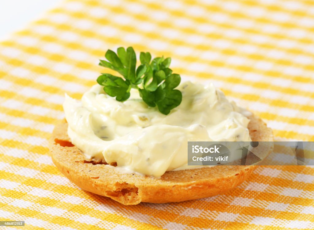 Cracker with cheese spread Round cracker with cream cheese spread Appetizer Stock Photo