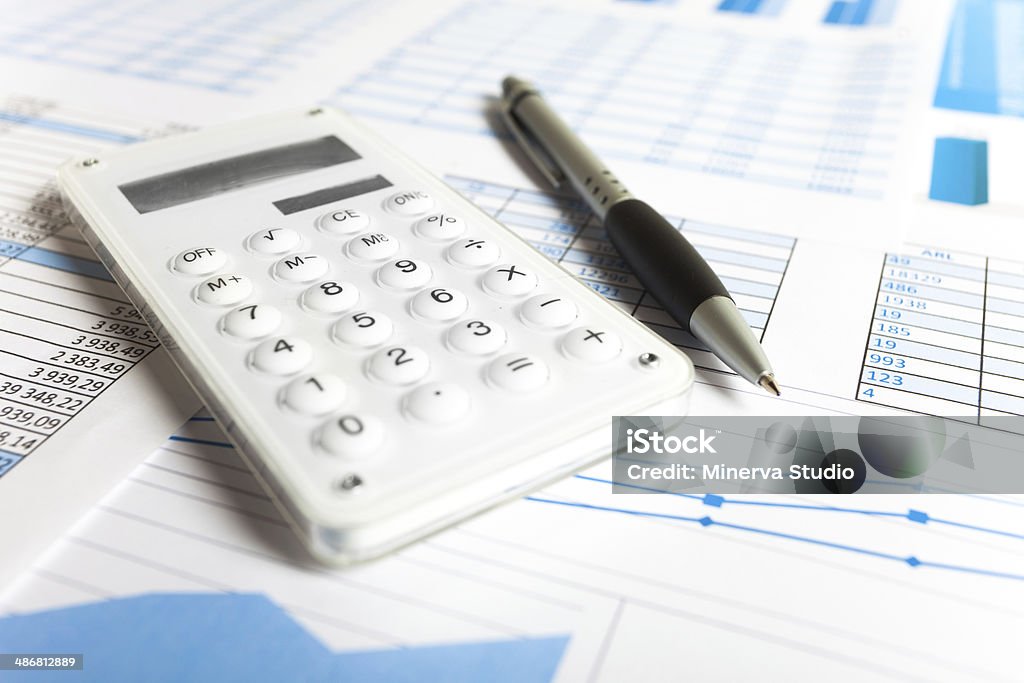 Business Items Calculator and business items on a desk Analyzing Stock Photo