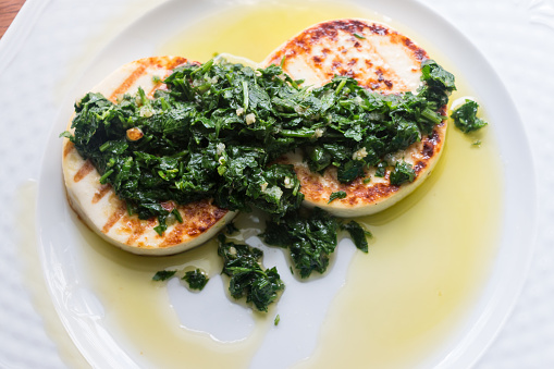 Halloumi cheese with parsley, onion and olive oil.