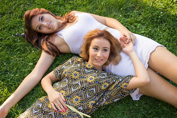 istock Shot from above, two happy girls having fun time, smiling. 486815602