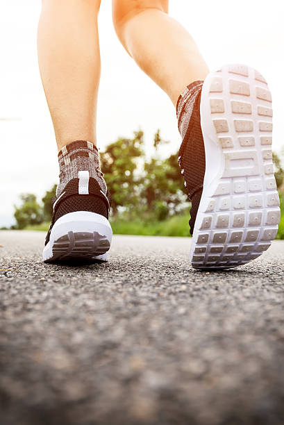 istock fitness woman legs running 486818120