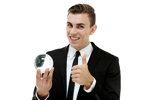 istock Businessman showing thumbs up with crystal ball 486818556