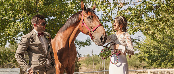 istock Couple with horses 486821672