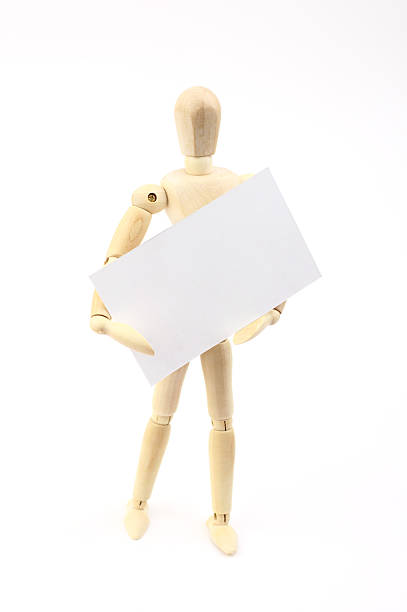 istock Wooden man holding blank card 486822578