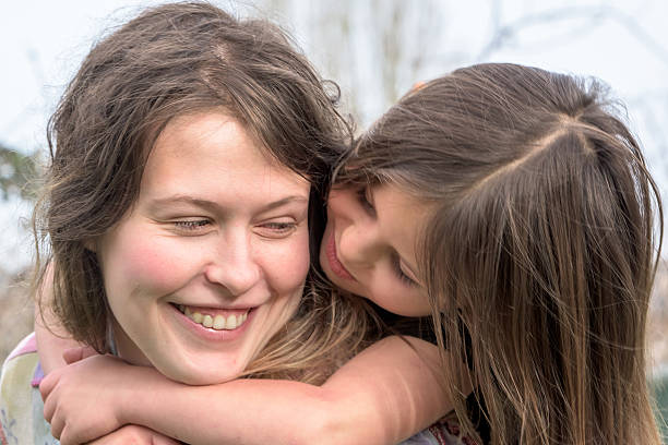 istock woman posing with her daughter 486825774
