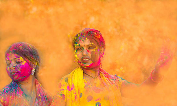 istock Girls celebrating Holi- India 486825828