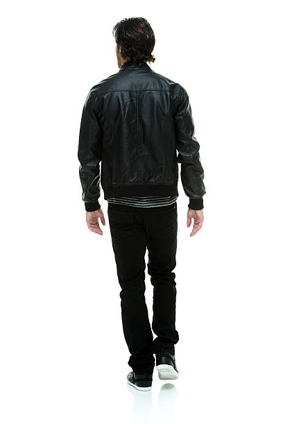 istock Rear view of casual man walking 486825842