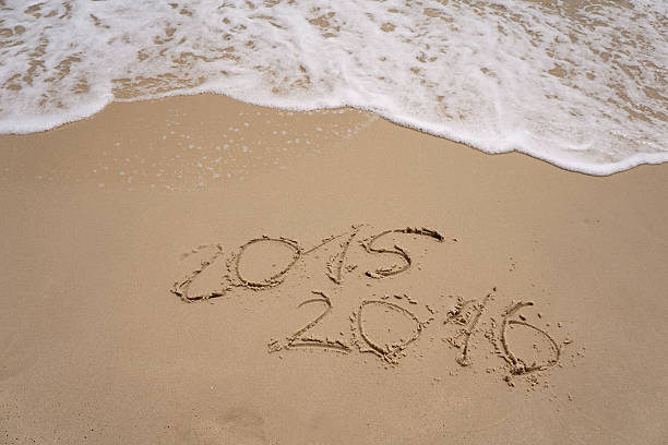 istock 2015 and 2016 year on the sand beach 486826052