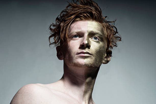 istock Portrait of man with gold face 486827850