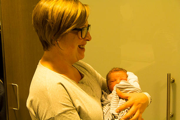 istock Mother with glasses and baby 486829088