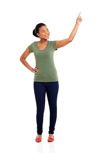 istock young african woman pointing up 486831377