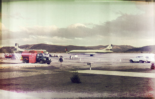 Image of a vintage airport slide with interesting colors and textures.
