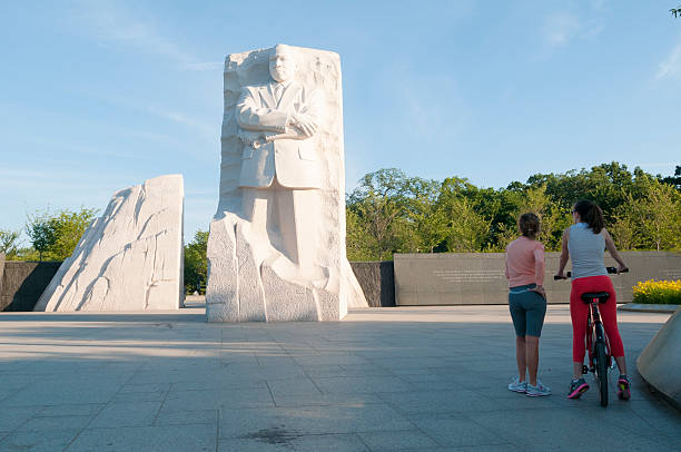 Martin Luther King Jr Memorial Washington DC, USA - June 17, 2012: Two women pause during their early morning exercise to view the Martin Luther King Jr. Memorial in Washington DC martin luther king jr memorial stock pictures, royalty-free photos & images