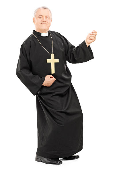 Happy priest playing air guitar Happy priest playing air guitar isolated on white background priest photos stock pictures, royalty-free photos & images