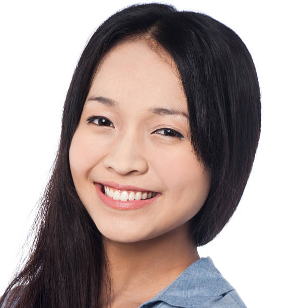 istock Young smiling chinese woman posing casually 486834649