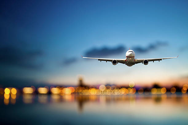 business travel perspective view of jet airliner in flight with bokeh background mid air stock pictures, royalty-free photos & images