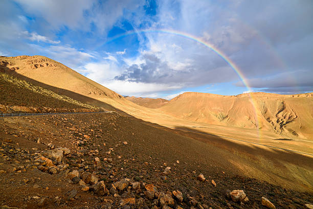 Rainbow on a mountain road in High Atlas, Morocco stock photo