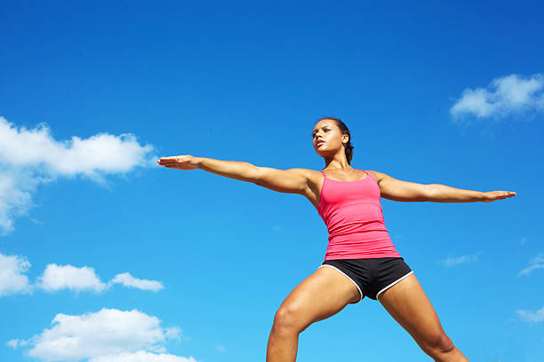 istock Young Beautiful Mixed Race Woman Doing Yoga Warrior Pose 486836545