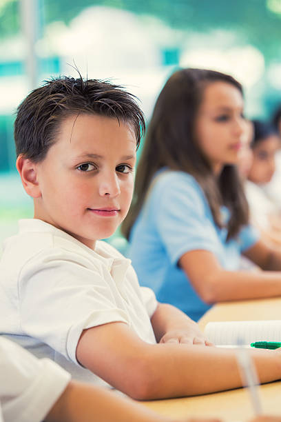 istock Little boy in private elementary school sitting at desk 486837188