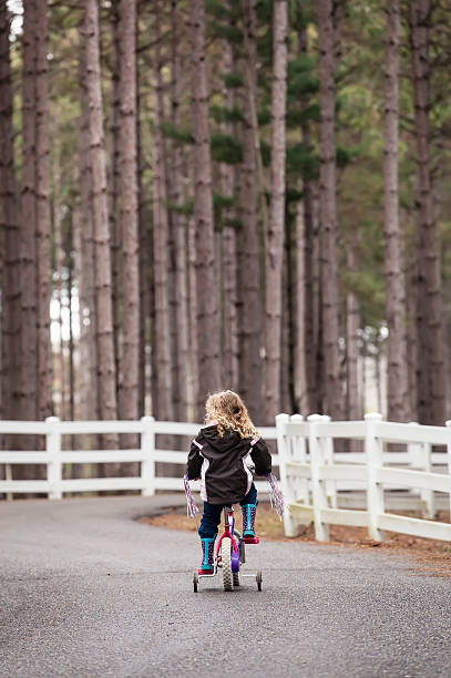 istock Girl Riding Bike 486838721