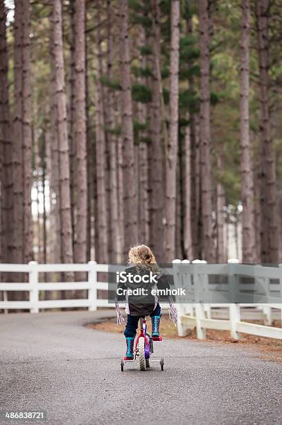 Girl Riding Bike Stock Photo - Download Image Now - 4-5 Years, Bicycle, Blond Hair