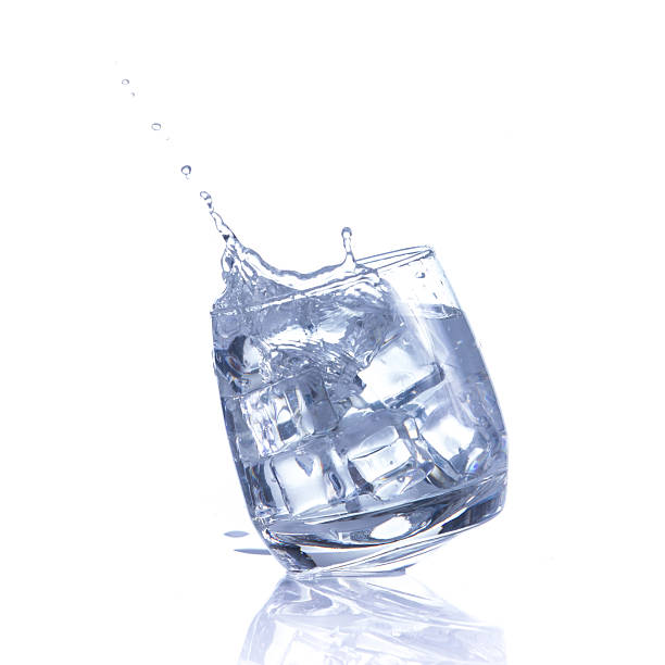 istock Water is poured into a glass with ice cubes 486840118
