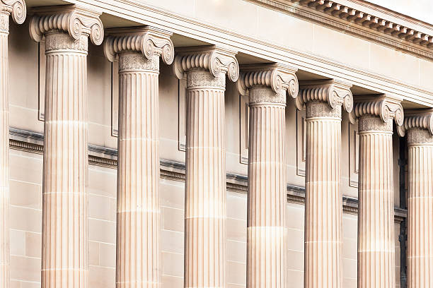 Row of classical columns, top part capital Top part of classical columns, capital, full frame horizontal composition colonnade stock pictures, royalty-free photos & images