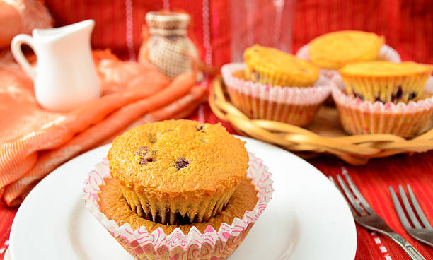 istock Homemade blackcurrent muffins in paper cupcake holder 486841410