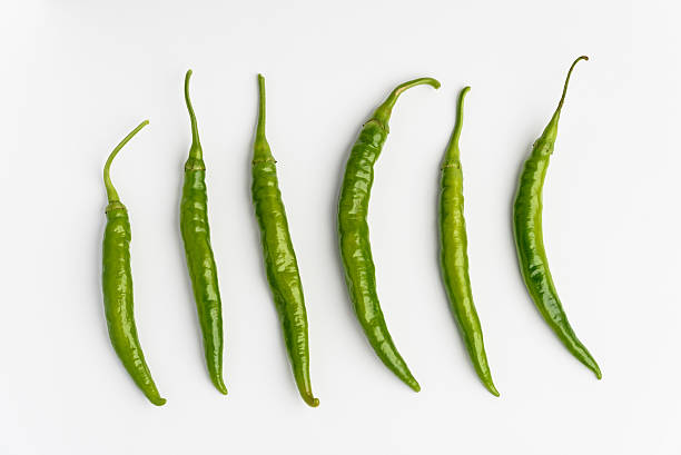 Green chilli peppers ob white background stock photo