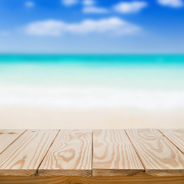 istock Wood table and blue sea background 486841978