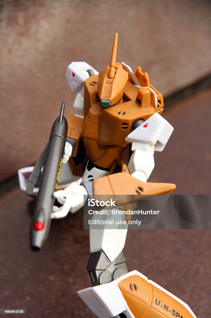 Transforming Defender Vancouver, Canada - August 31, 2015: A battloid mode veritech fighter from the Macross animated television series against a metal background on Granville Island in Vancouver. The model was distributed in North America by robotech,com.  1980-1989 Stock Photo