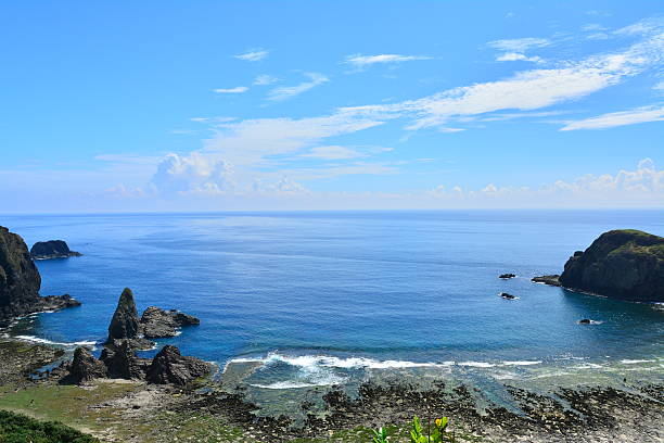 istock Jagged rocks with blue and zigzag coastline 486843852