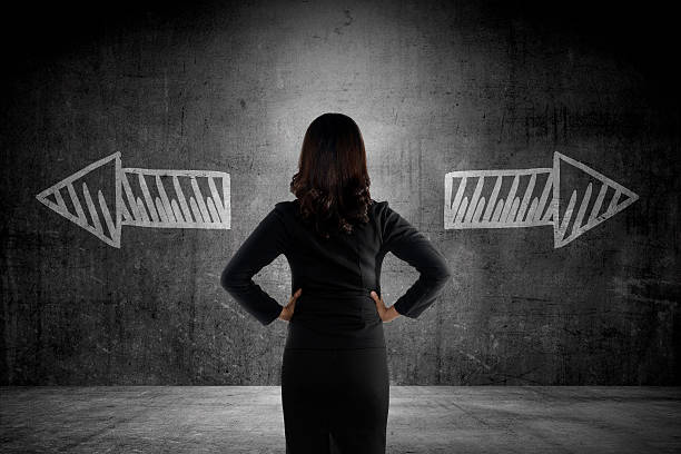 istock Business woman has to choose between two way 486846660