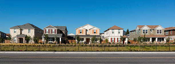 Row of Colorful Houses A front view of a row of new houses. image created 21st century multi colored arrangement outdoors stock pictures, royalty-free photos & images