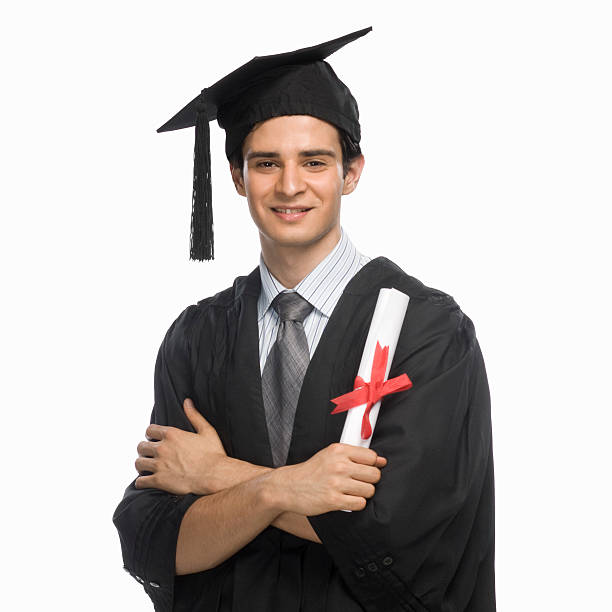 Portrait of a happy male graduate holding his diploma stock photo