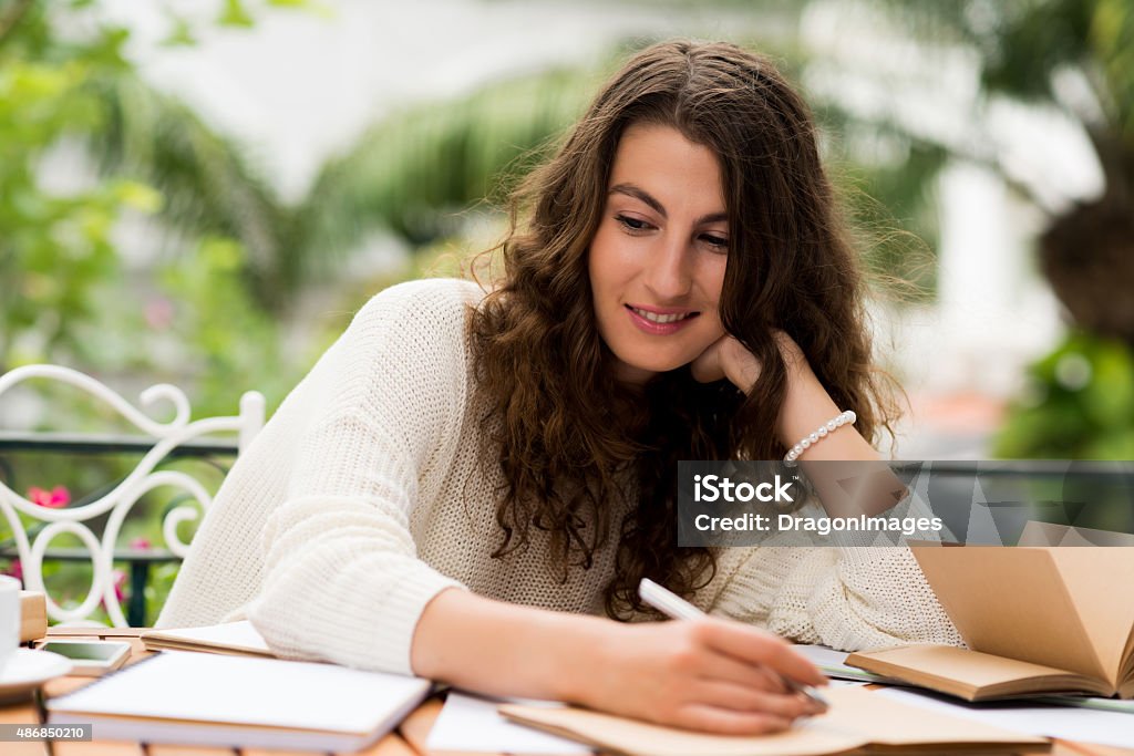 Creative woman Portrait of creative woman writing down her ideas 2015 Stock Photo