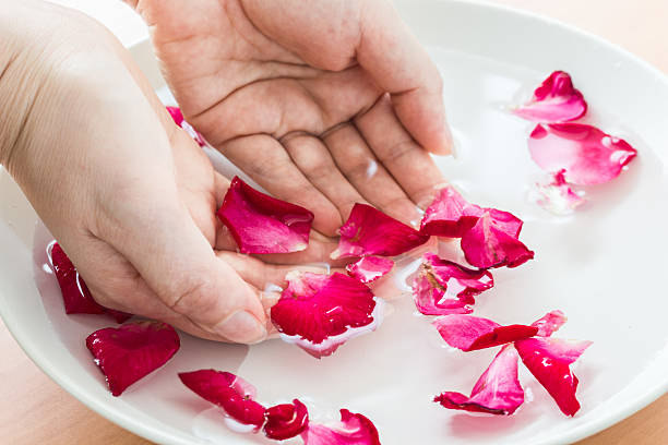 istock hand of aroma spa water on table wooden 486851430