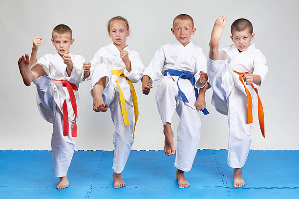 istock Four athletes beats the blow mae-geri 486852872