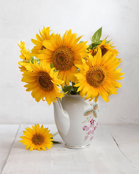istock Bouquet of sunflowers in old ceramic jug 486853322