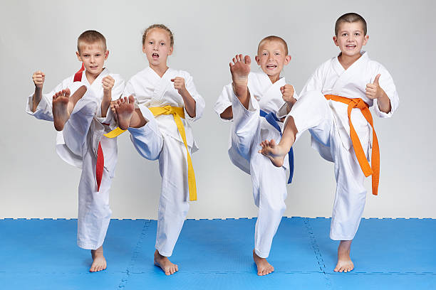 istock Mae geri are training four athletes in karategi 486853694