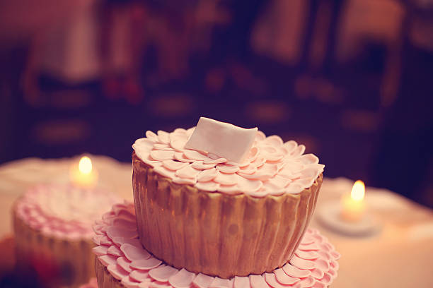 Small delicious cake with candles in the background