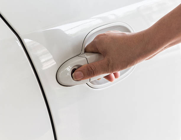 istock hand opening luxury car door 486854128