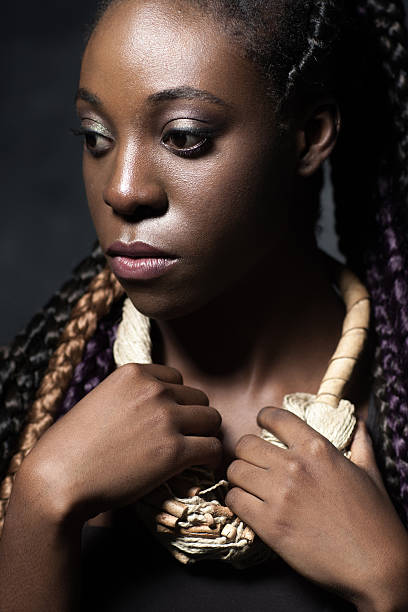 istock pensive black woman with designer necklace 486855924