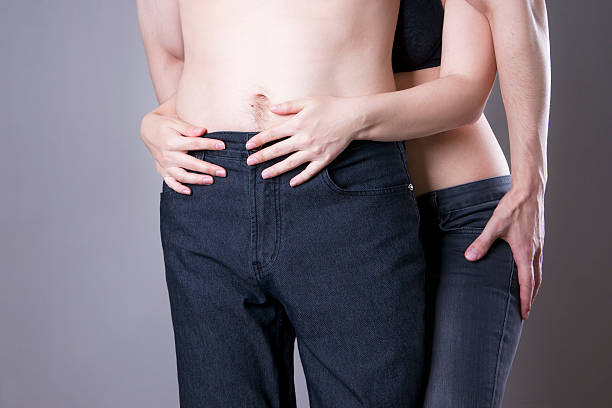 istock Man and woman in jeans hug each other 486856084